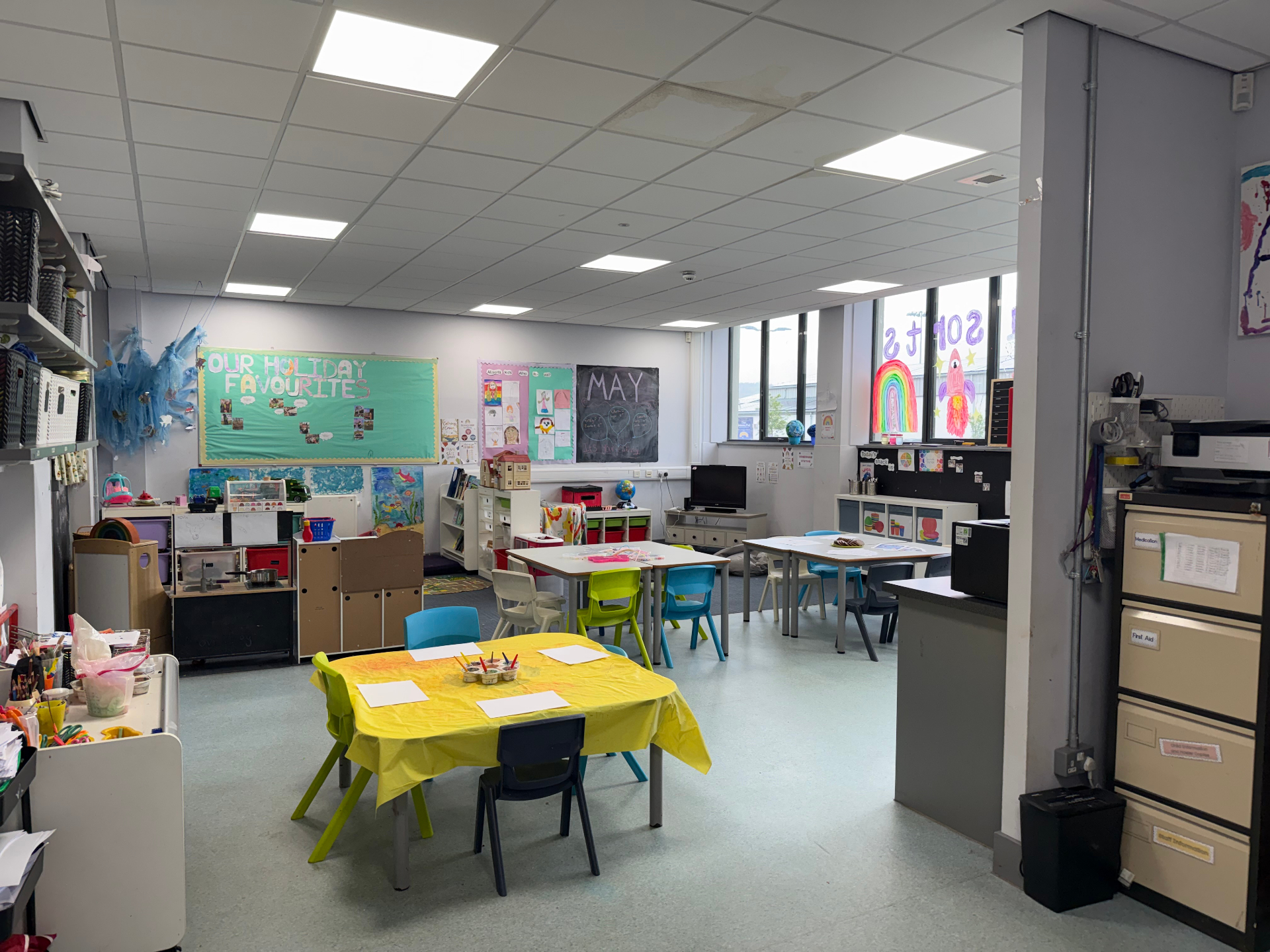 Wide view of the AllSorts main room with activity tables and play areas